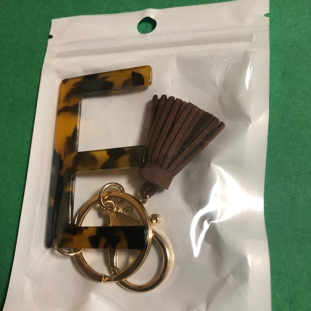 Leopard letter “E” key chain with tassel.